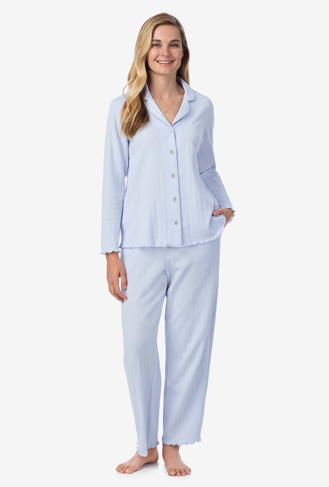 A lady wearing blue long sleeve cotton pointelle long pajama set.