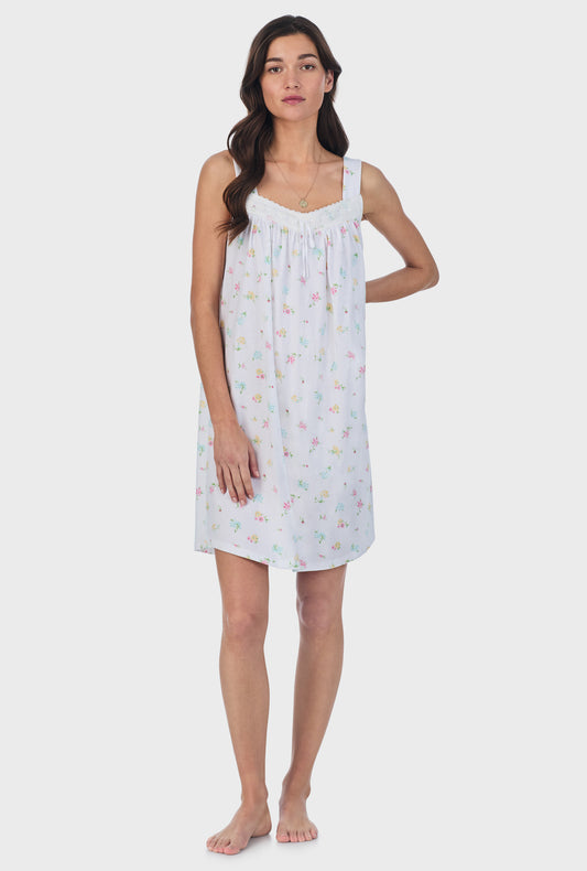 A lady wearing white sleeveless Cotton Short Nightgown with Cottage Bouquet print.