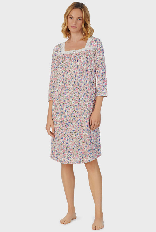 A lady wearing pink short sleeve Waltz Nightgown with Floral Fields print