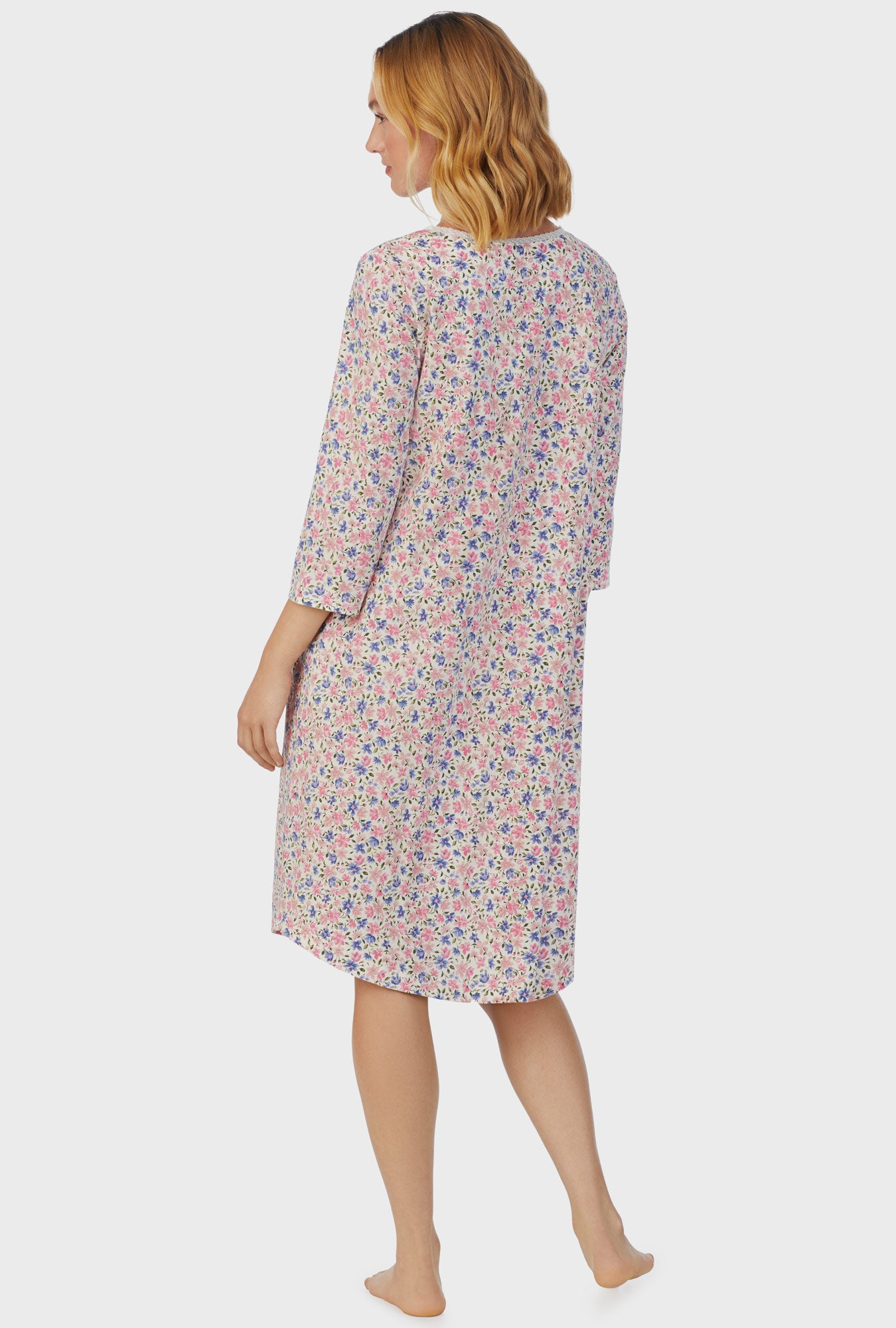 A lady wearing pink short sleeve Waltz Nightgown with Floral Fields print