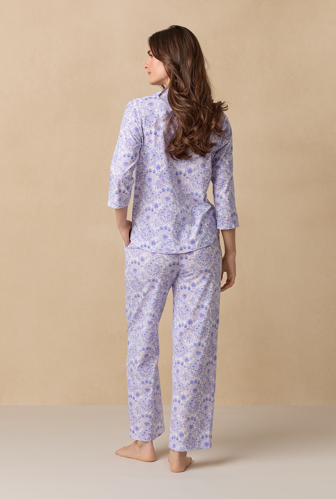 A lady wearing Purple Paisley Cotton Long Pajama Set