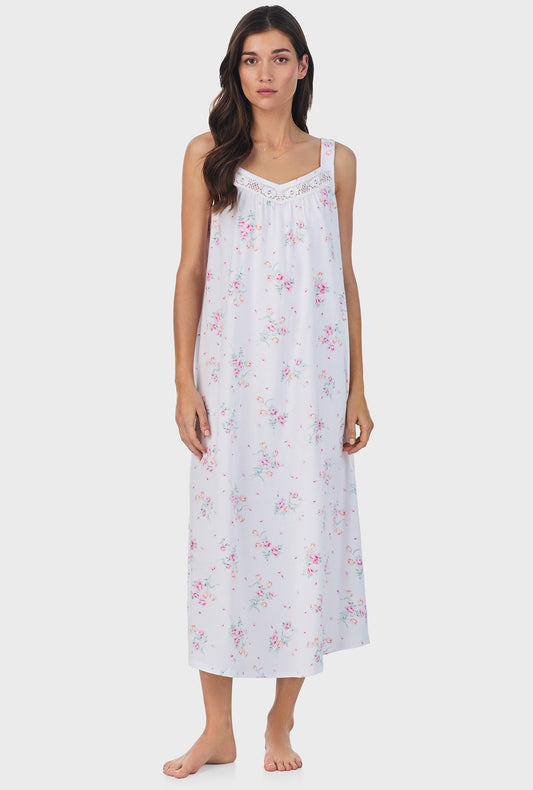 A lady wearing pink sleeveless cotton ballet nightgown with floral bouquet print.