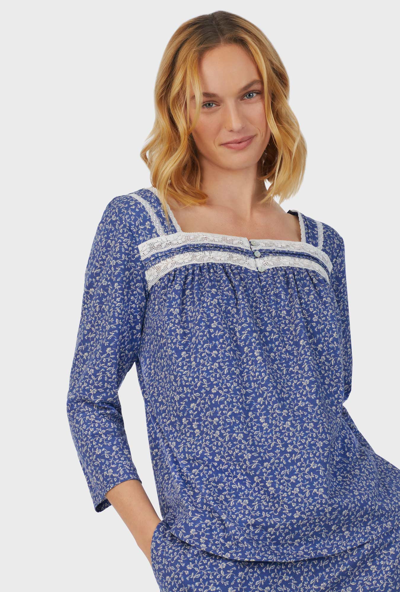 A lady wearing blue short sleeve Long Pajama Set with Midnight Blooms print
