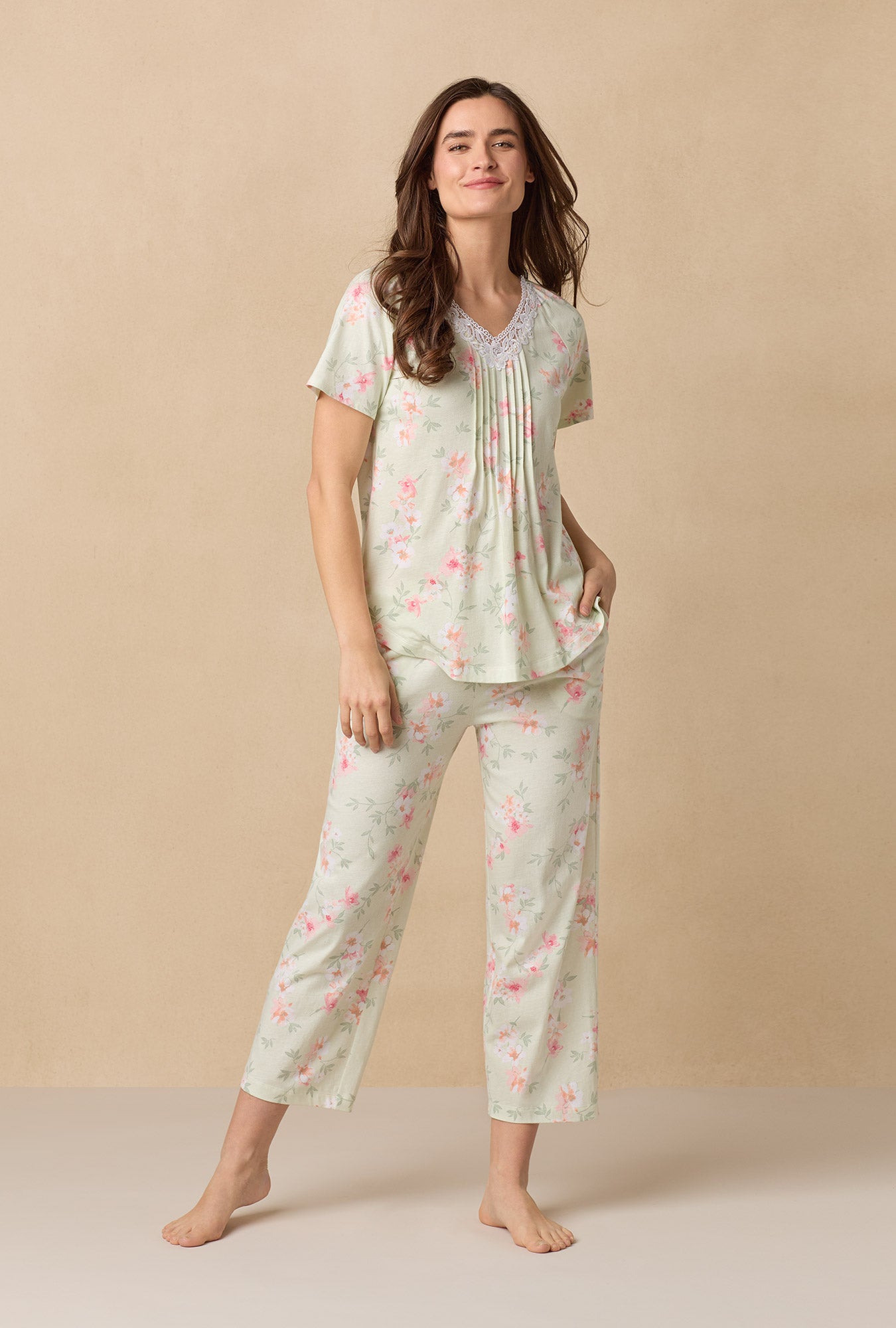 A lady wearing Sage Floral Bloom Capri Cotton Knit Pajama Set