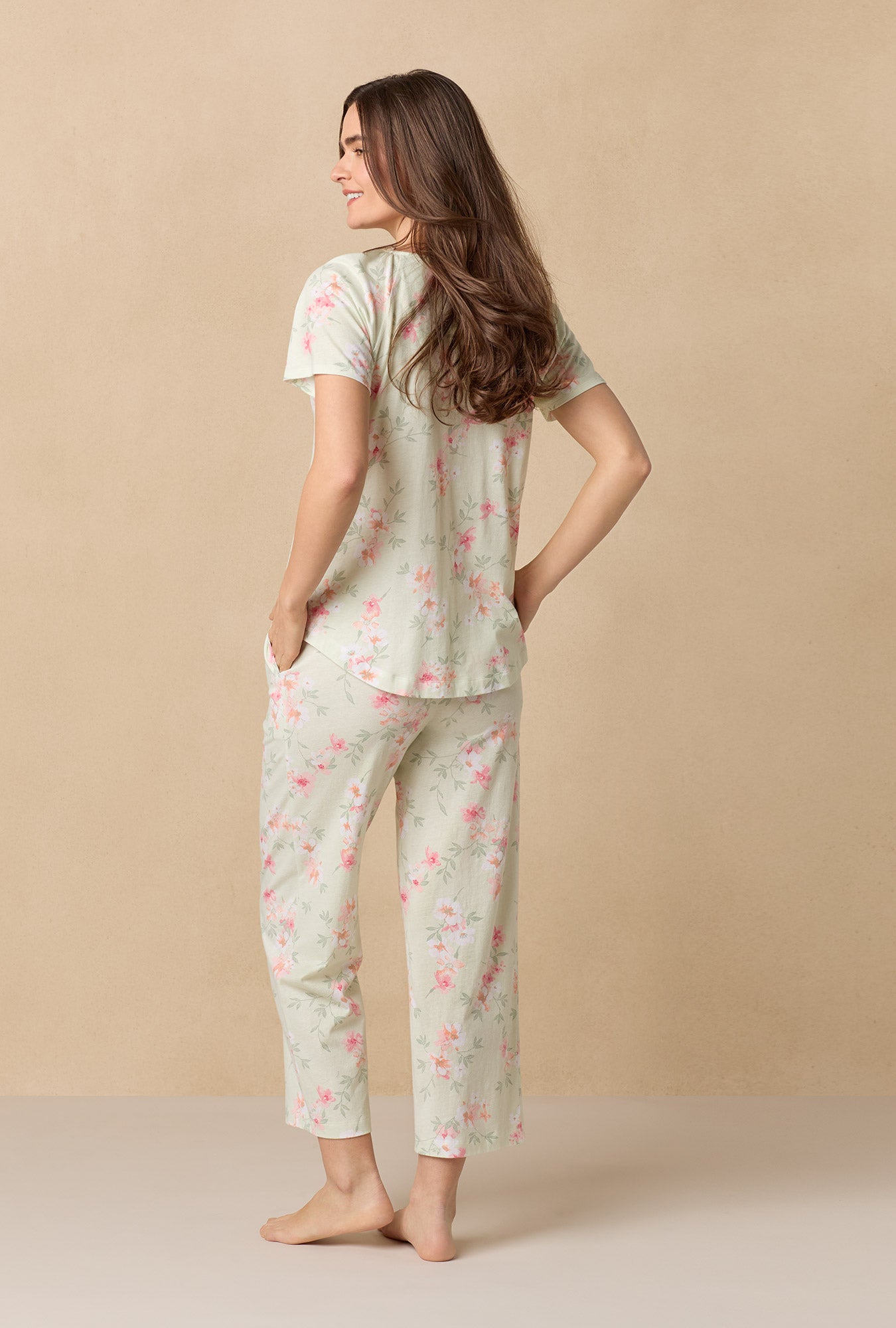 A lady wearing Sage Floral Bloom Capri Cotton Knit Pajama Set