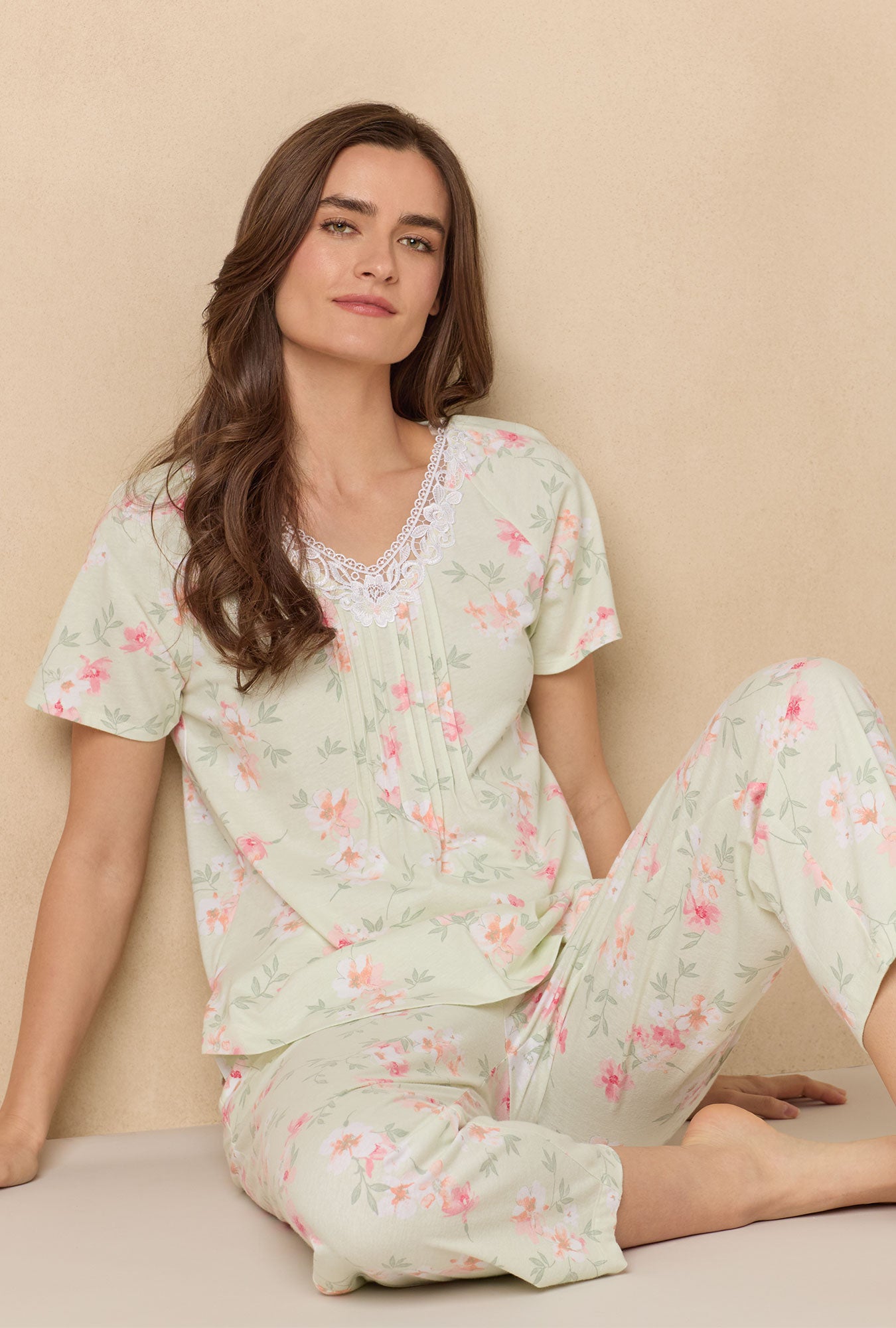 A lady wearing Sage Floral Bloom Capri Cotton Knit Pajama Set