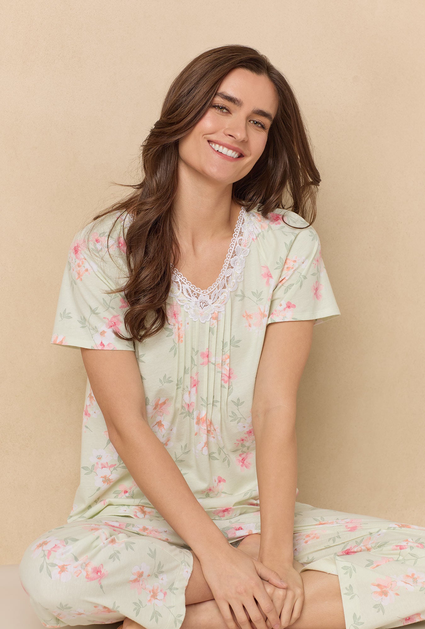 A lady wearing Sage Floral Bloom Capri Cotton Knit Pajama Set