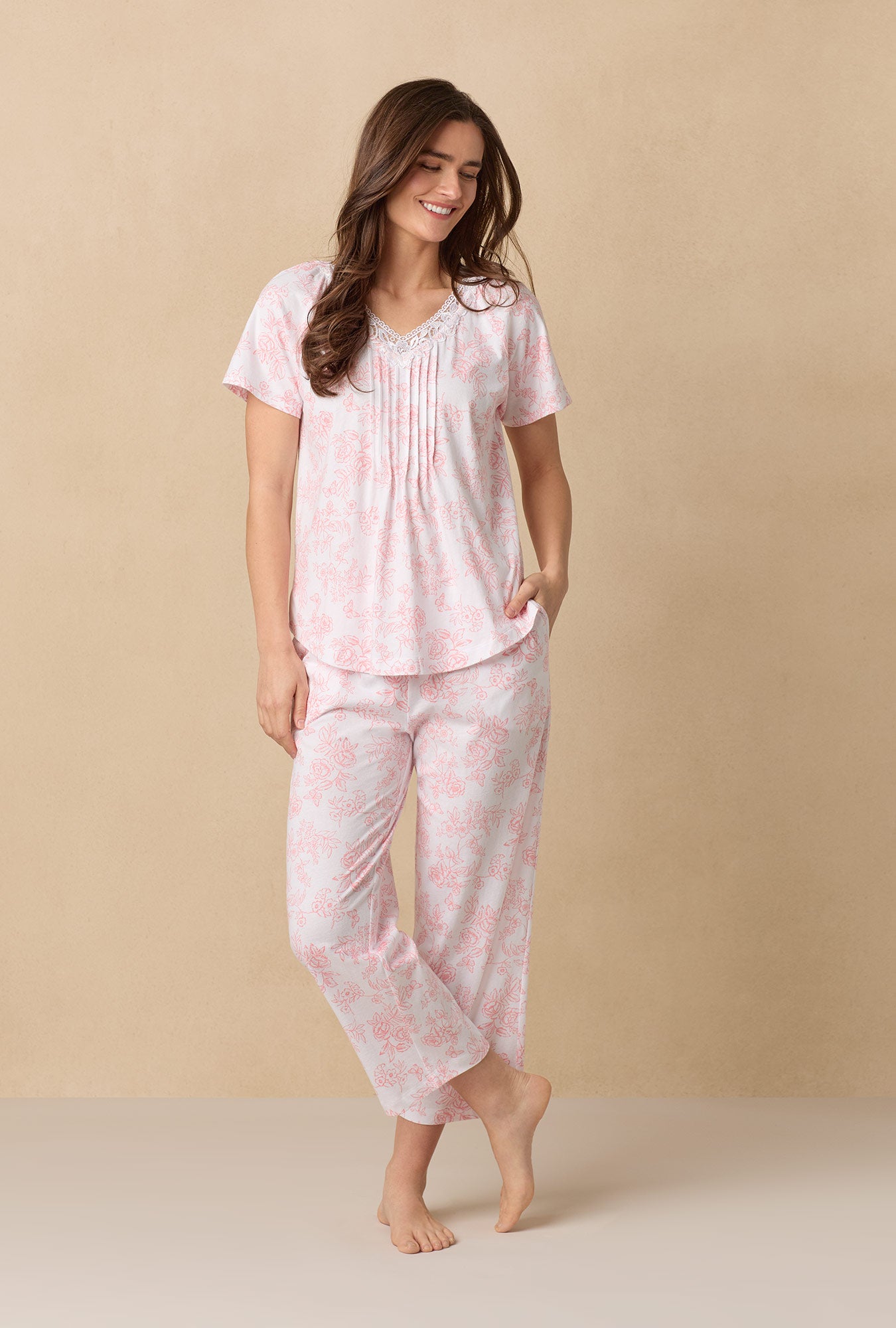 A lady wearing Coral Toile Capri Cotton Knit Pajama Set