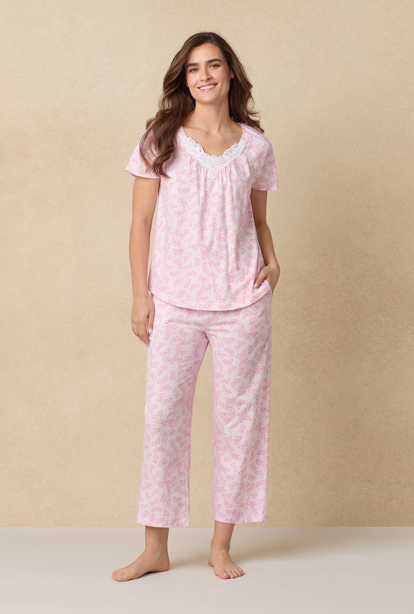 A lady wearing Pink Butterfly Cotton Capri Pajama Set