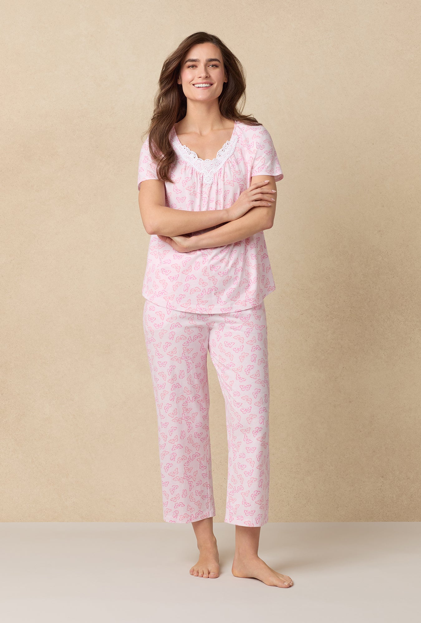 A lady wearing Pink Butterfly Cotton Capri Pajama Set