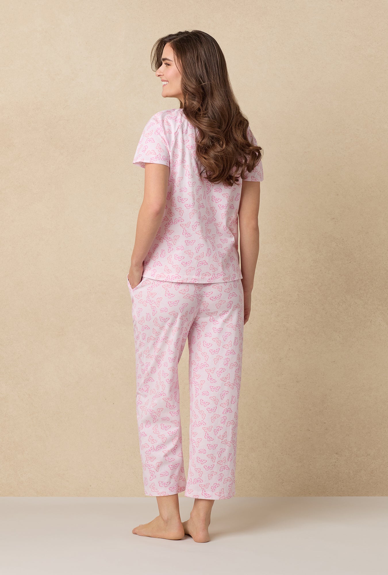 A lady wearing Pink Butterfly Cotton Capri Pajama Set