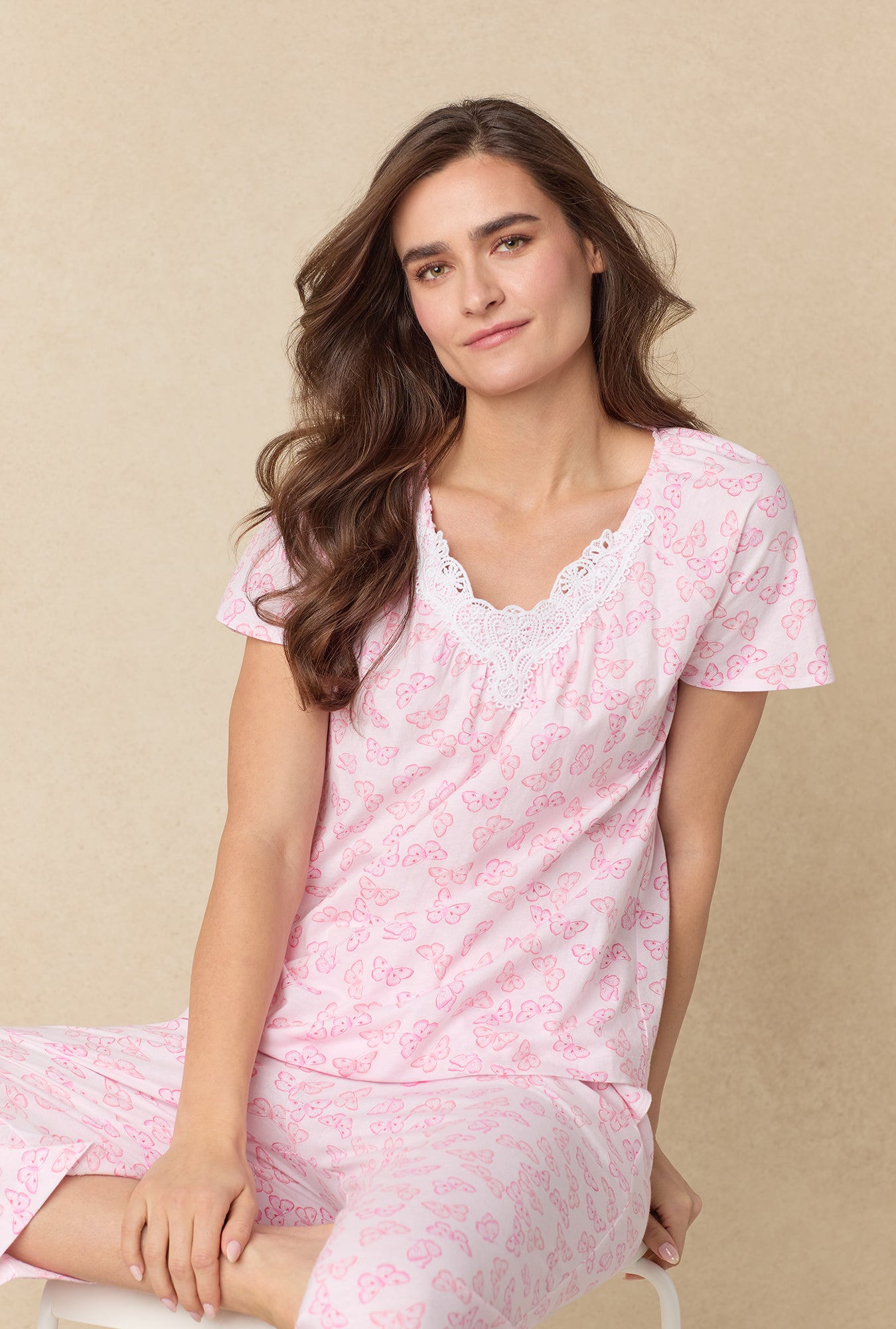 A lady wearing Pink Butterfly Cotton Capri Pajama Set