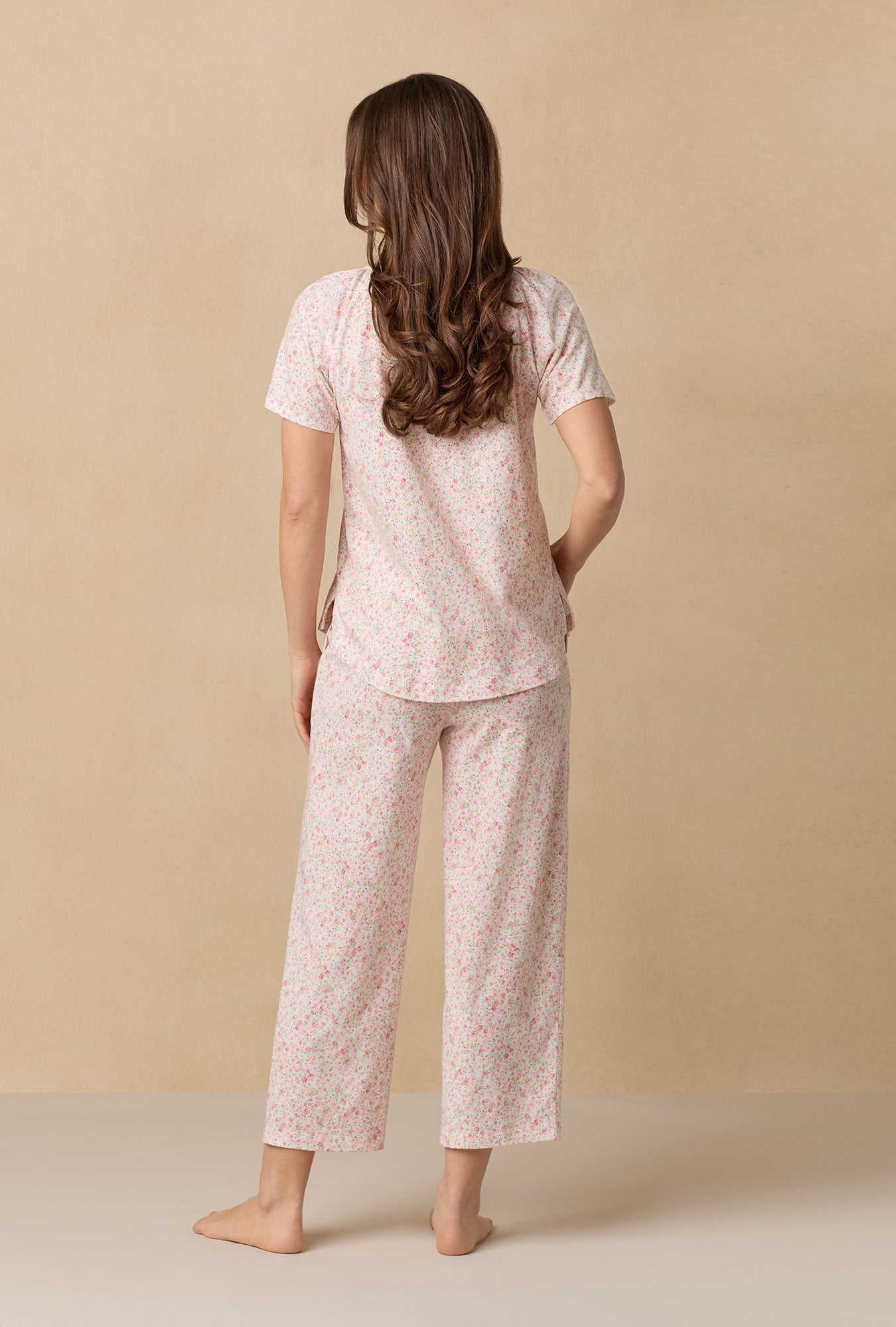 A lady wearing Meadow Floral Capri Cotton Knit Pajama Set