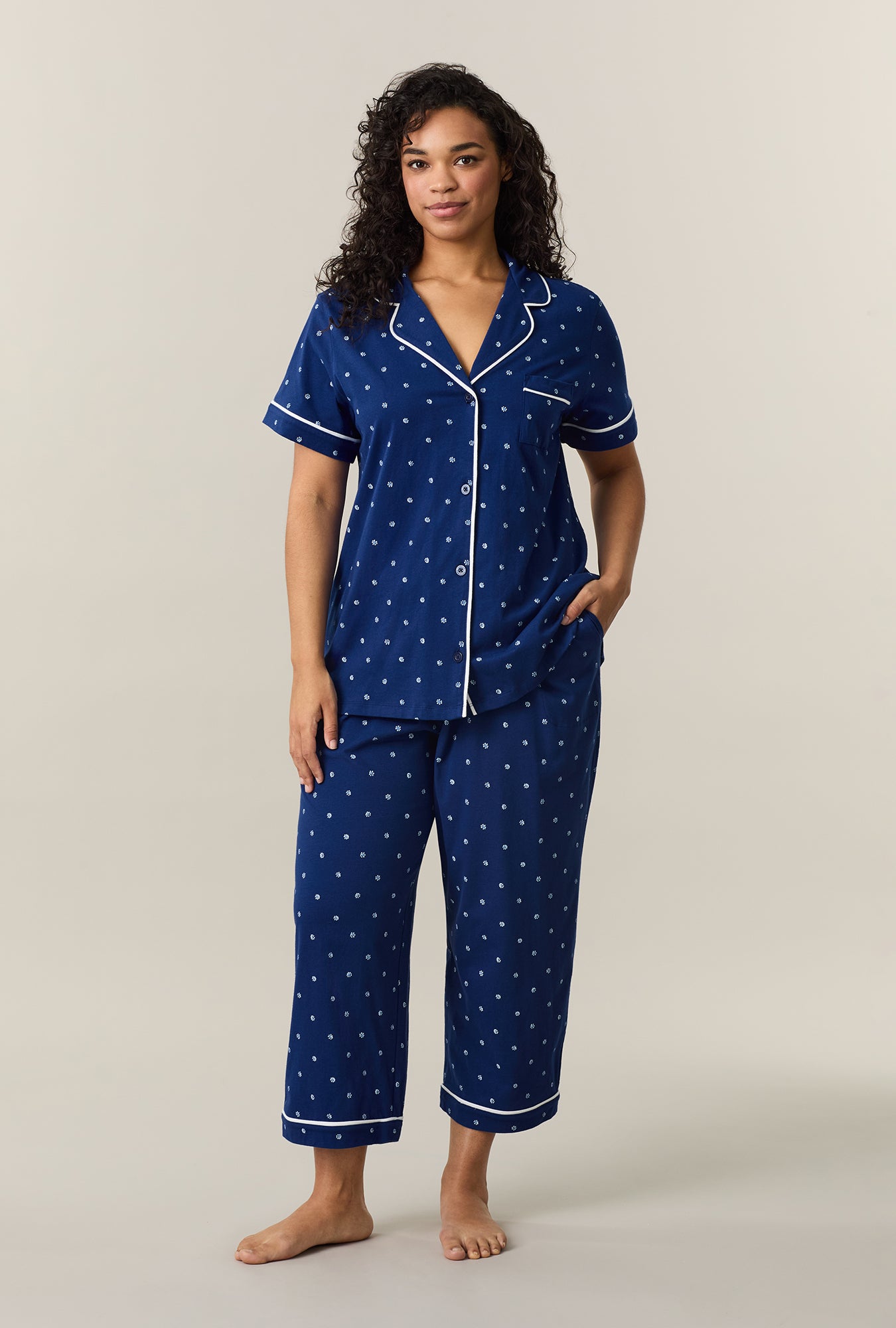 A lady wearing Blue Depths Ditsy Cotton Capri Pajama Set
