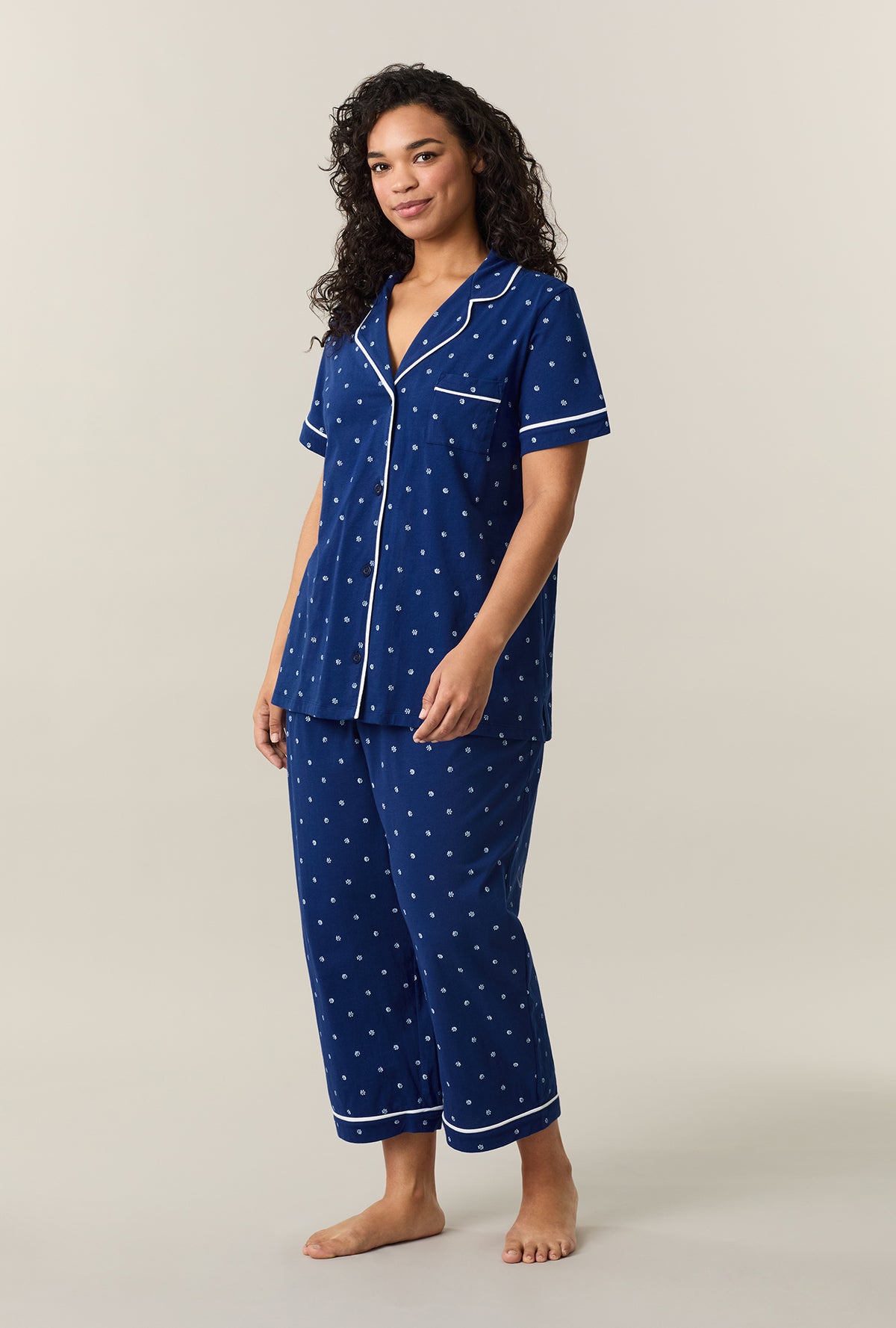 A lady wearing Blue Depths Ditsy Cotton Capri Pajama Set