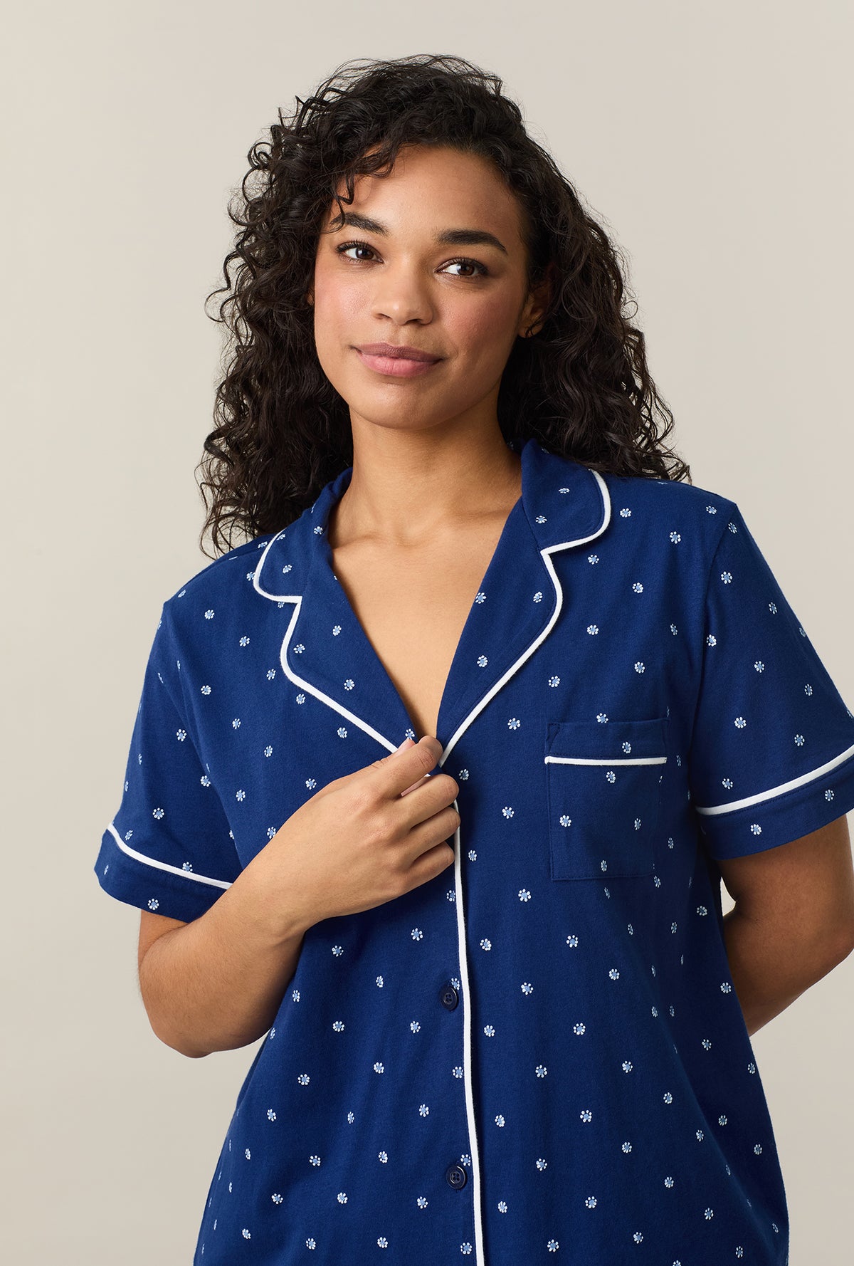 A lady wearing Blue Depths Ditsy Cotton Capri Pajama Set