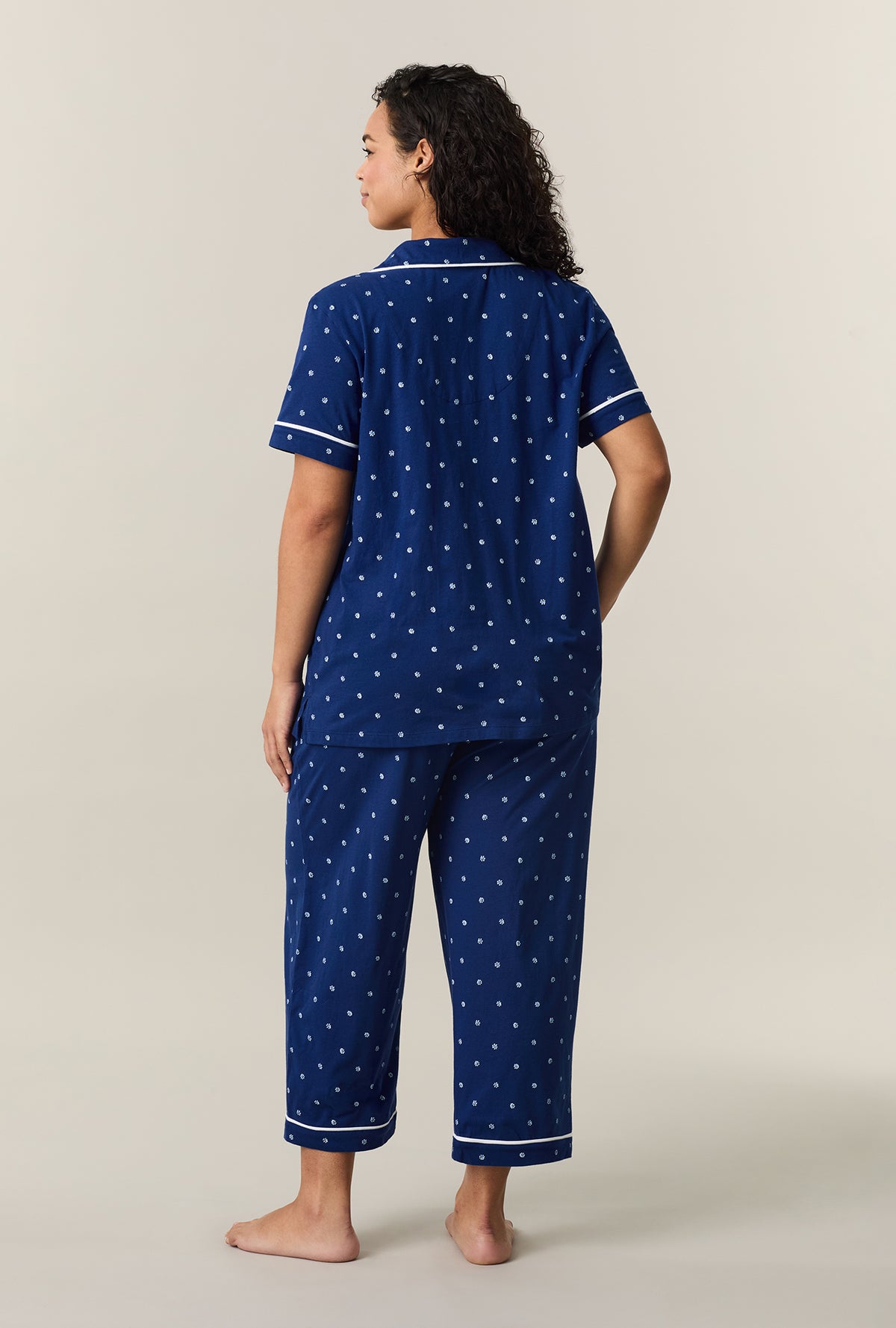 A lady wearing Blue Depths Ditsy Cotton Capri Pajama Set