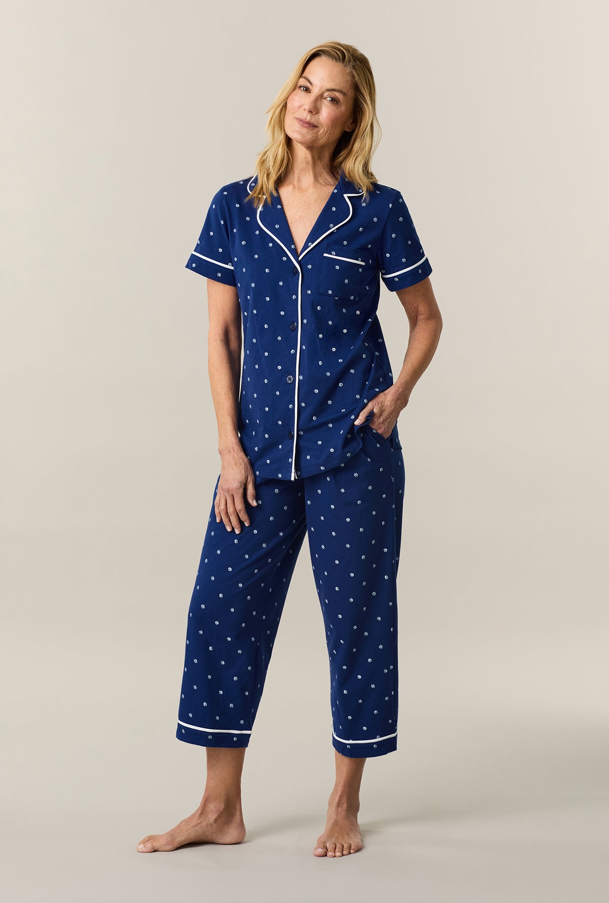 A lady wearing Blue Depths Ditsy Cotton Capri Pajama Set