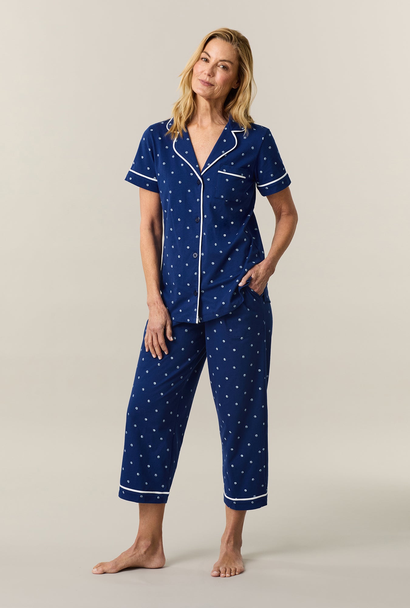 A lady wearing Blue Depths Ditsy Cotton Capri Pajama Set