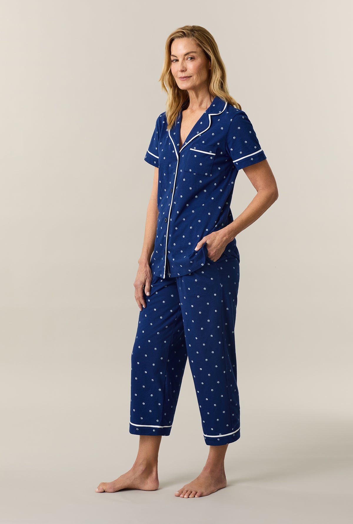 A lady wearing Blue Depths Ditsy Cotton Capri Pajama Set