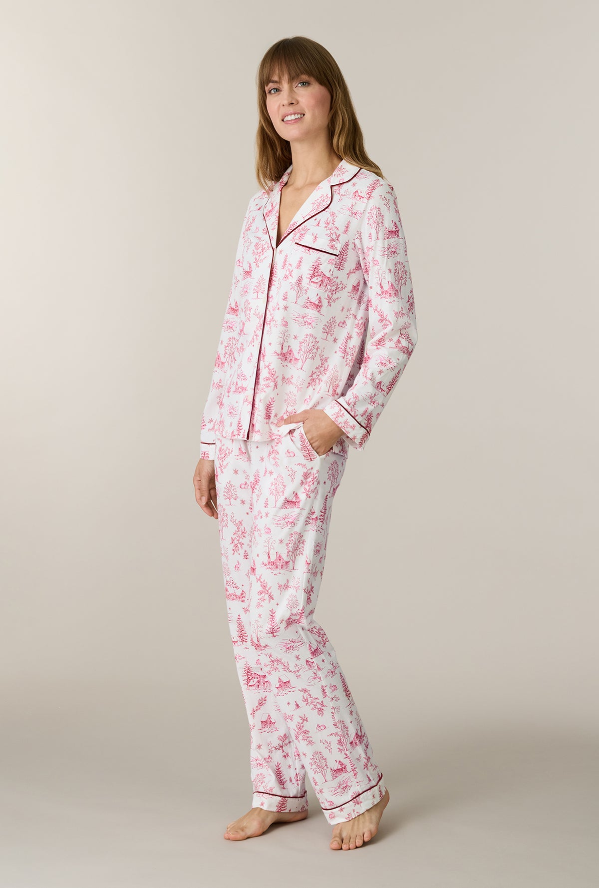 A lady wearing Winter Cottage Toile Cotton Long Pajama Set looking up