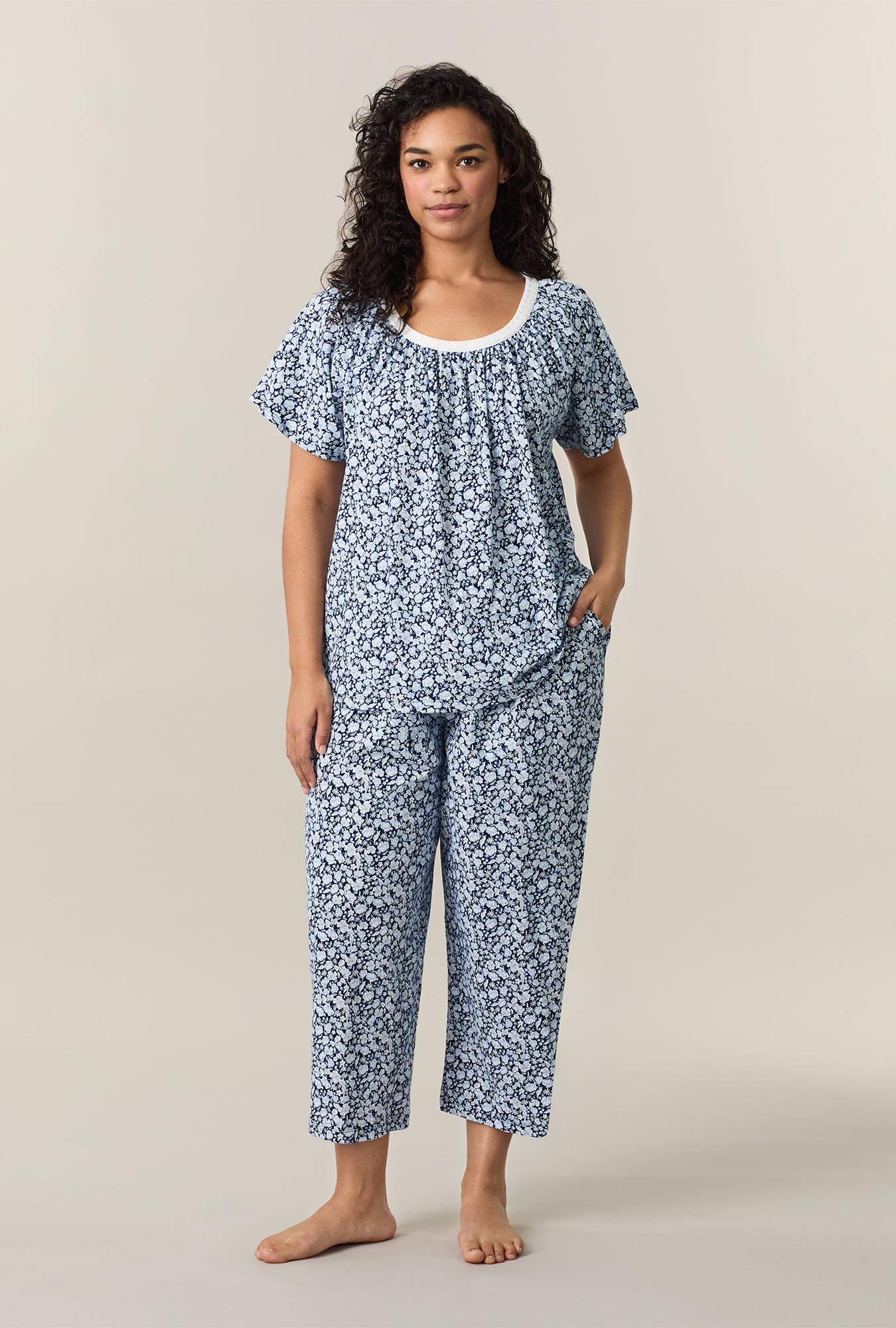 A lady wearing Blue Depths Floral Cotton Capri Pajama Set