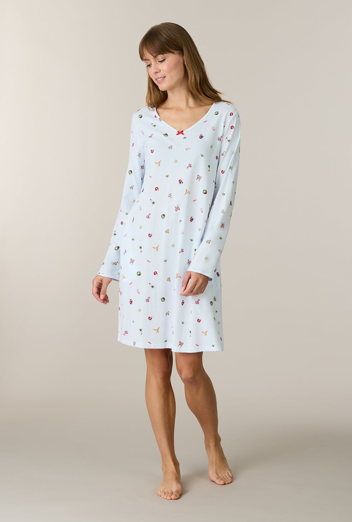 A lady wearing Holiday Keepsakes Cotton Short Nightgown looking down