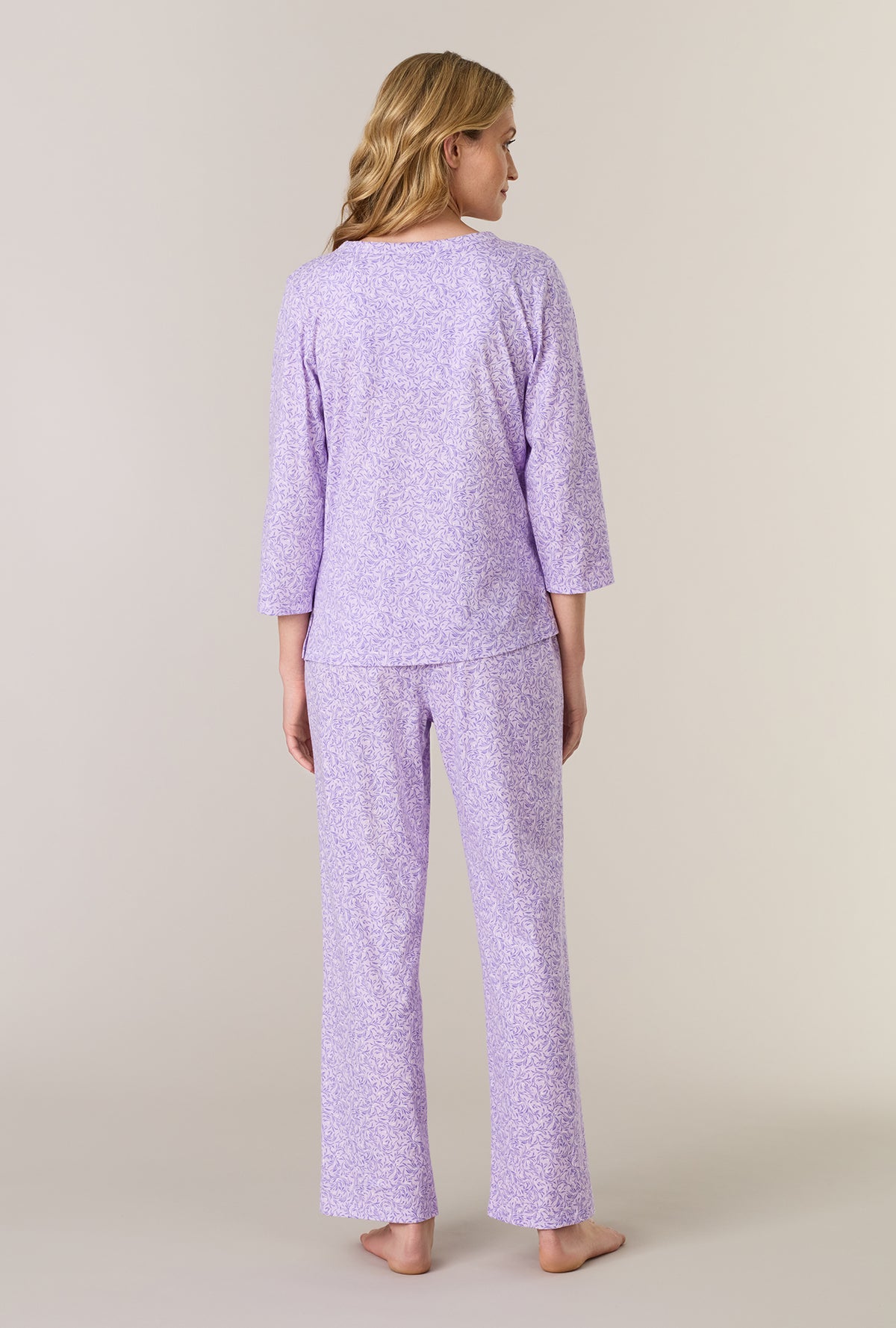 A lady wearing Lavendar Meadow Cotton Long Pajama Set back view