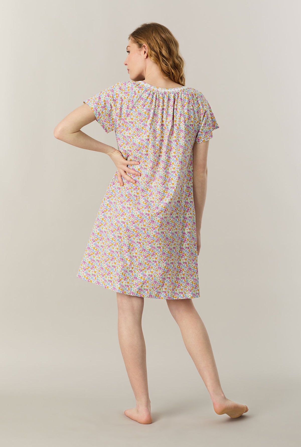 A lady wearing Summer Meadow Short Sleeve Cotton Short Nightgown back view