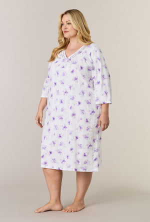 A lady wearing plus size Lilac Blooms Cotton Midi Nightgown looking left side