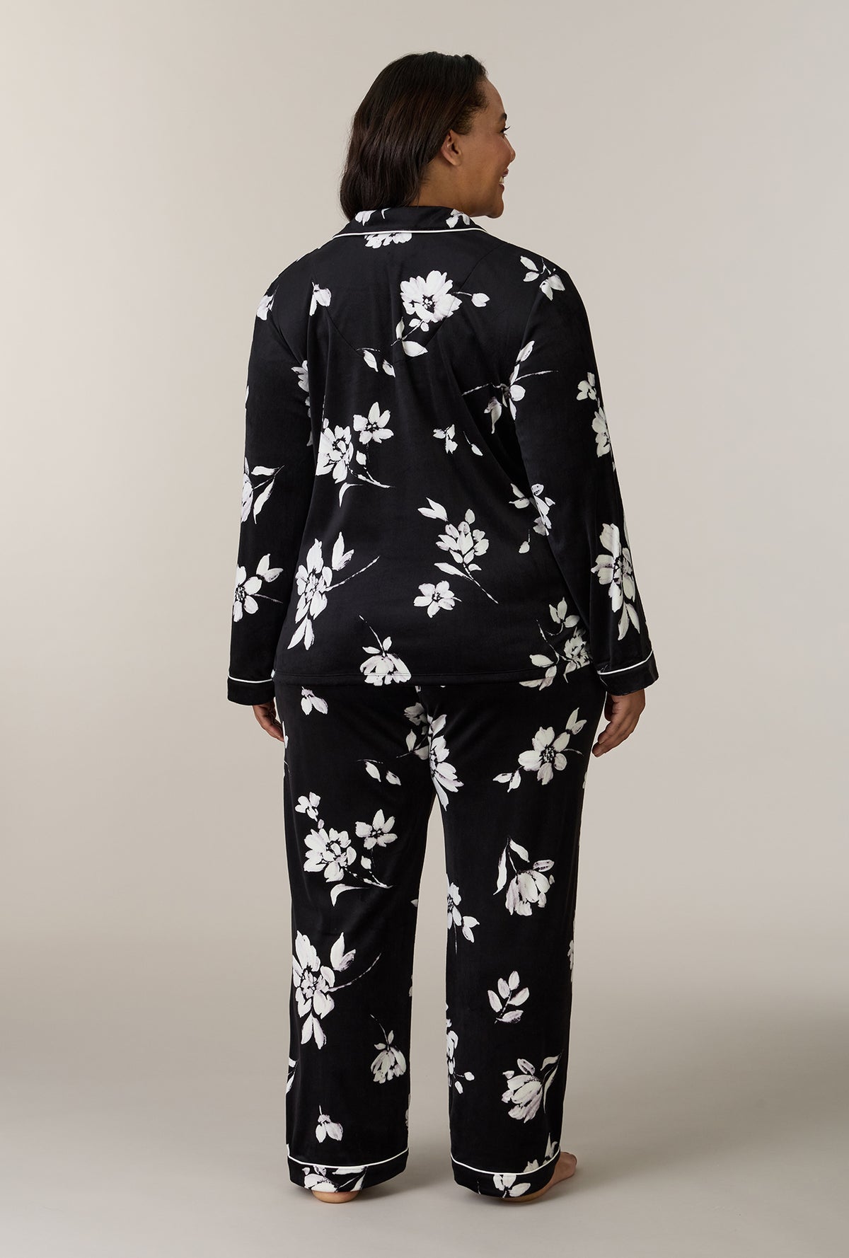 A lady wearing plus size Midnight Blossom Stretch Velour Notch Collar Long Pajama Set back view