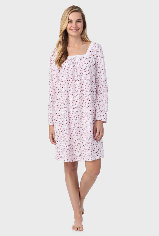 A lady wearing pink long sleeve cotton short nightgown with midi cardinal print.