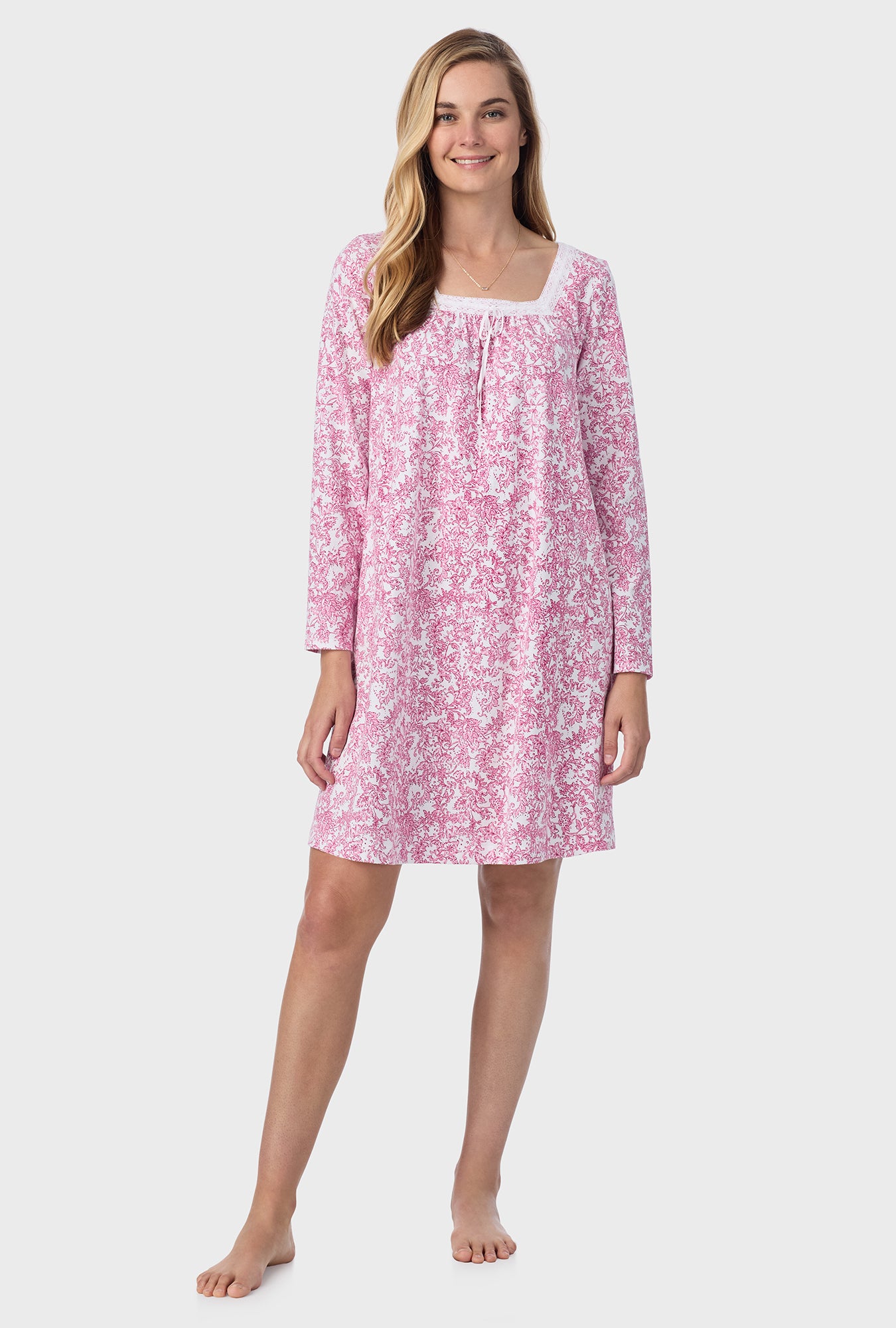 A lady wearing short nightgown with berry paisley print