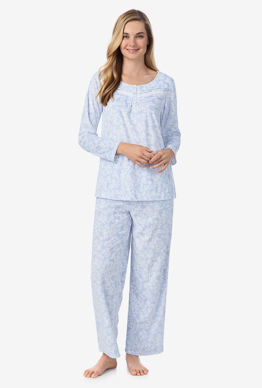 A lady wearing long pajama set with camellia print