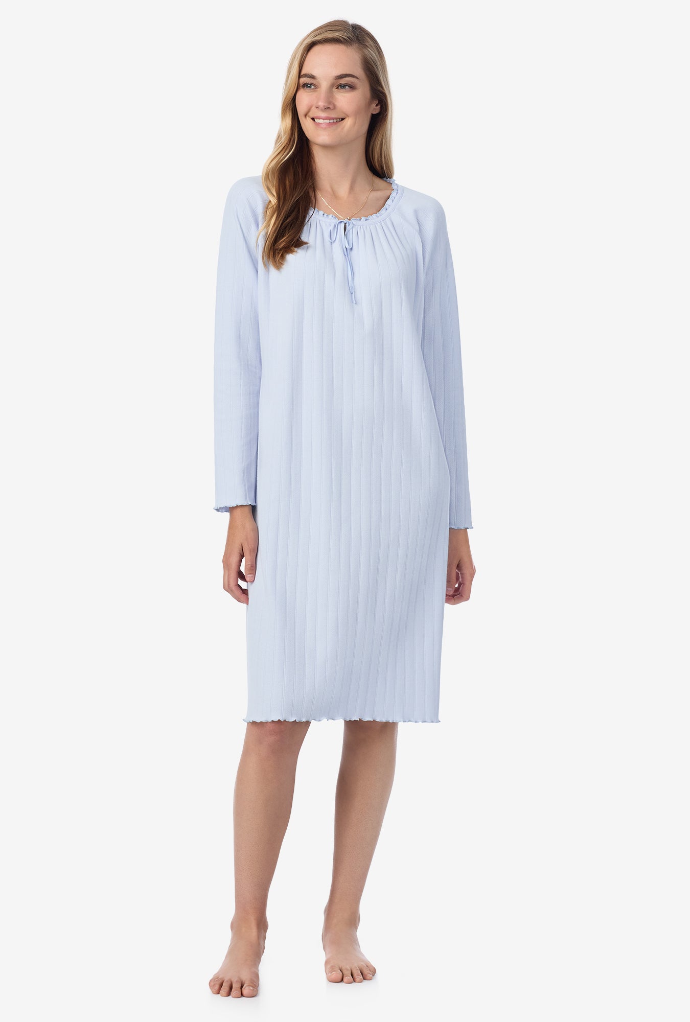 A lady wearing blue long sleeve cotton pointelle waltz nightgown.