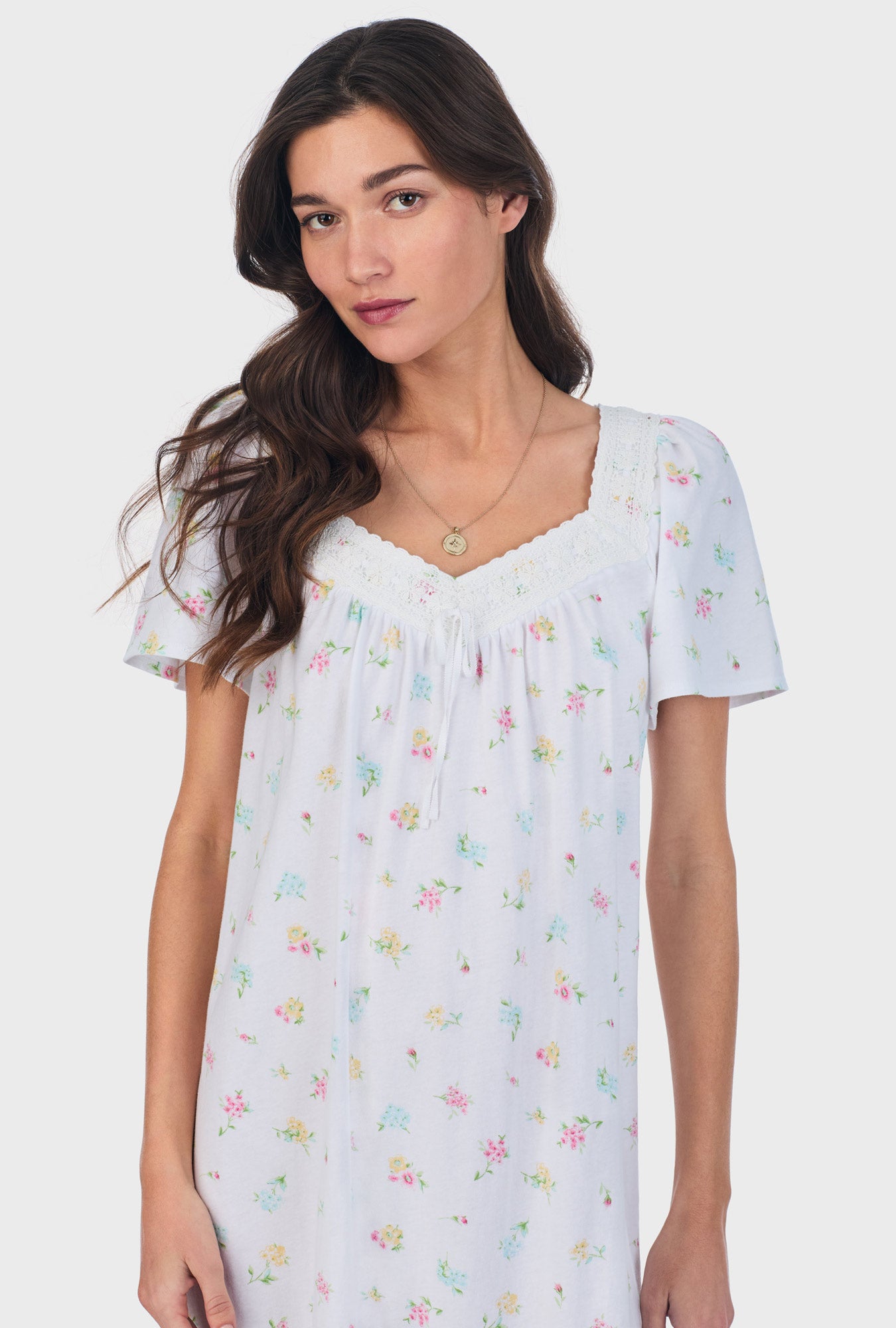A lady wearing white short Sleeve Cotton Waltz Nightgown with Cottage Bouquet print.