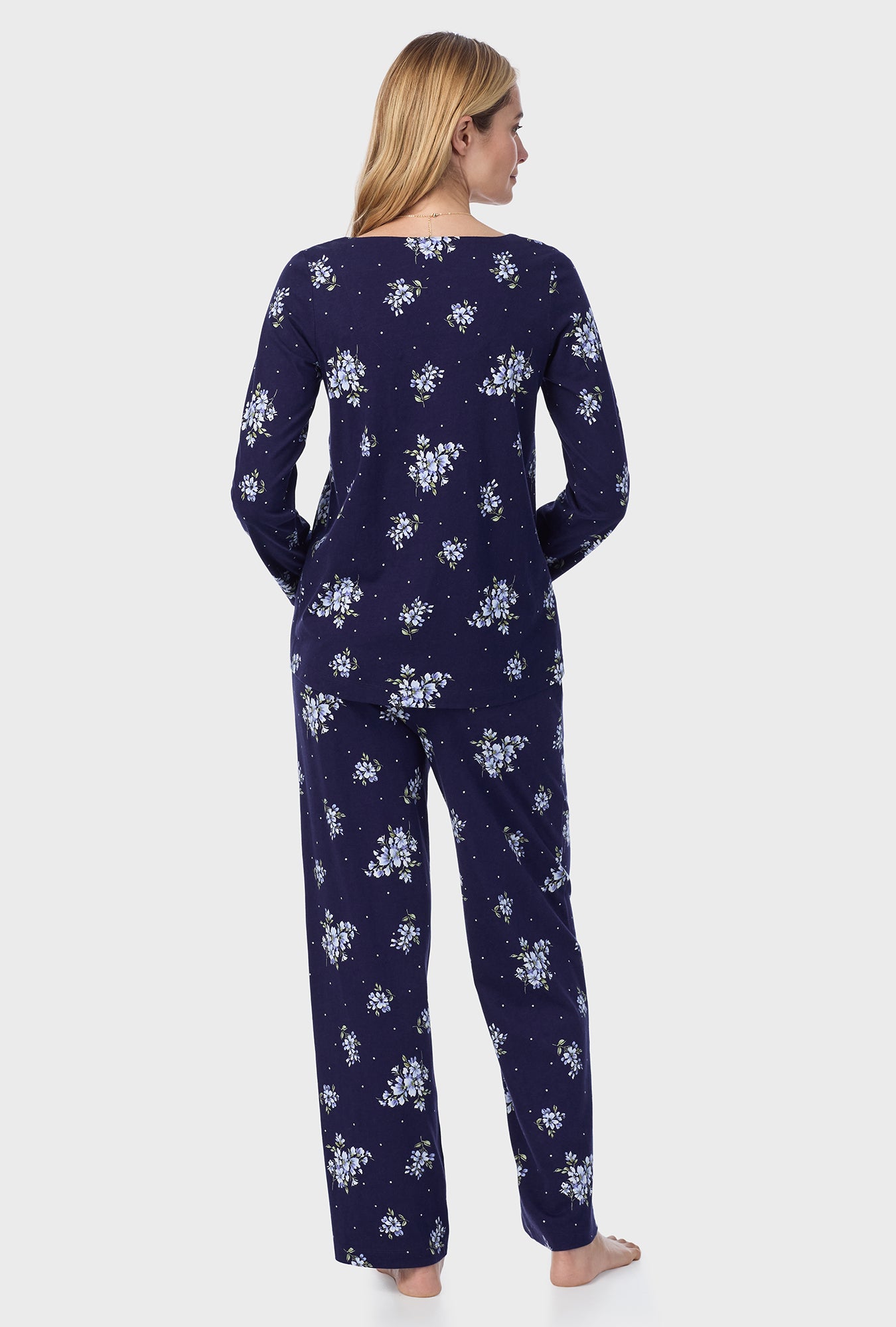 A lady wearing Navy Bouquet Cotton Long Pajama Set