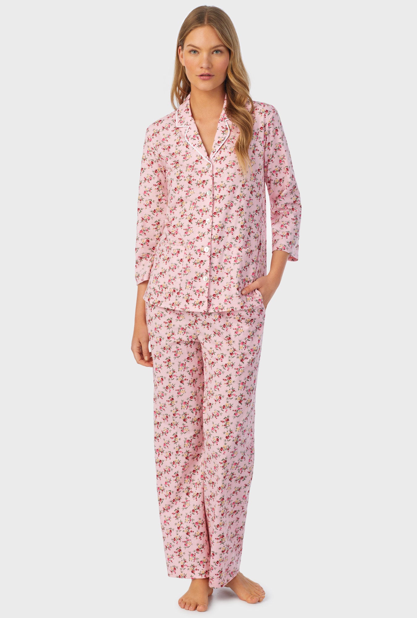 A lady wearing long sleeve pajama set with wild blooms print.
