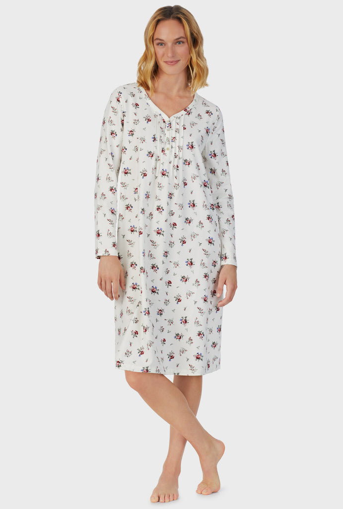 A lady wearing white long sleeve cotton rayon flannel waltz wild flower nightgown.