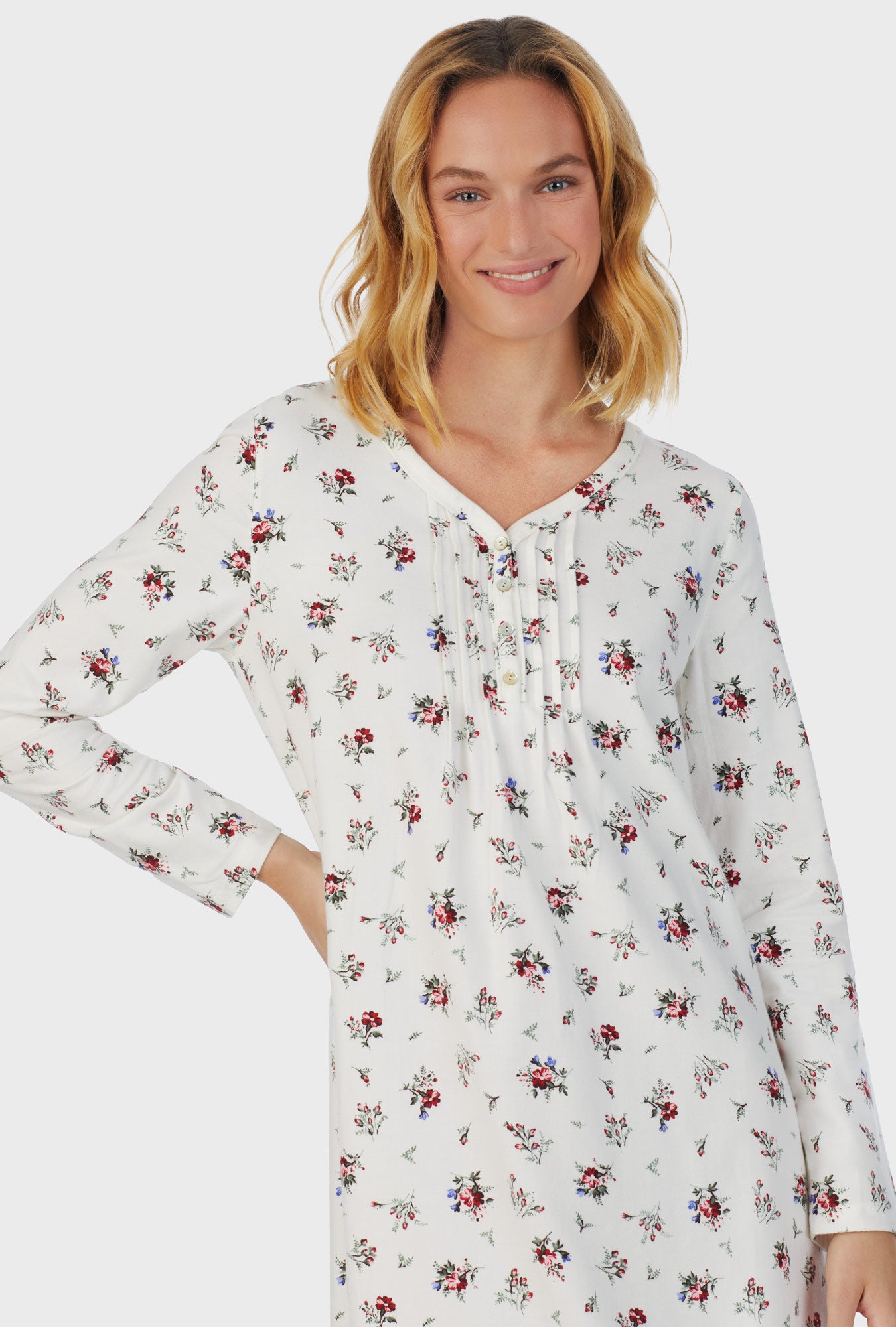 A lady wearing white long sleeve cotton rayon flannel waltz wild flower nightgown.