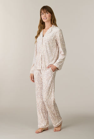 A lady wearing Soft Spots Stretch Velour Notch Collar Long Pajama Set looking up