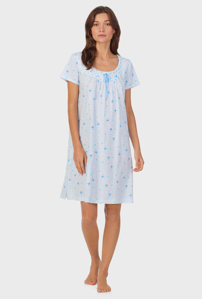 A lady wearing Blue Hummingbird Cotton Short Nightgown