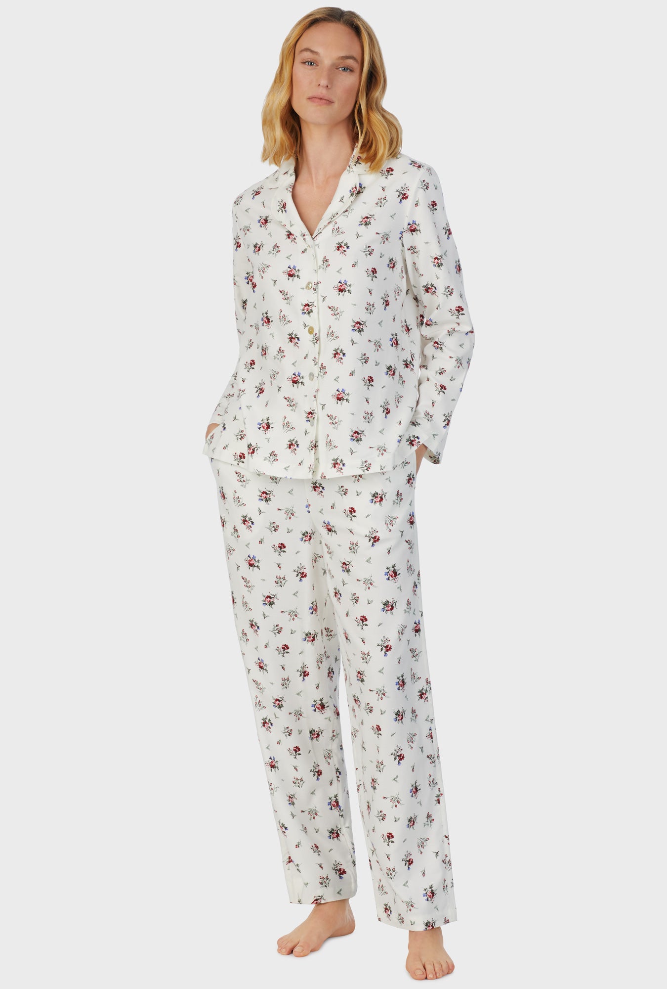 A lady wearing white long sleeve cotton rayon flannel wild flower pajama set.