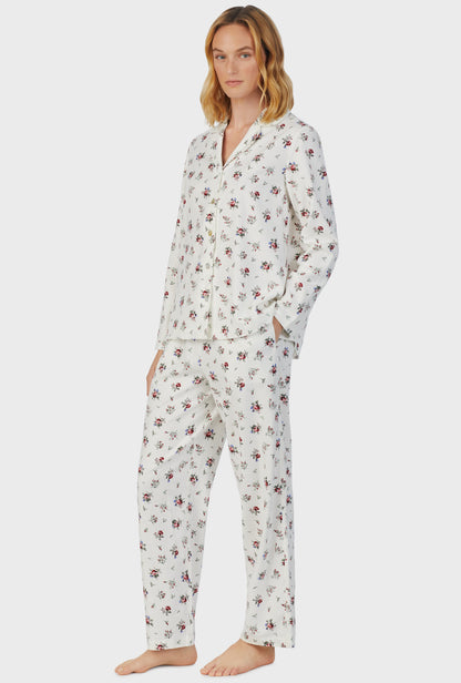 A lady wearing white long sleeve cotton rayon flannel wild flower pajama set.