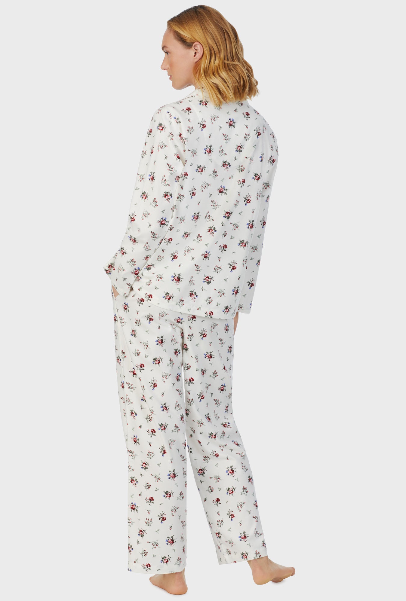 A lady wearing white long sleeve cotton rayon flannel wild flower pajama set.