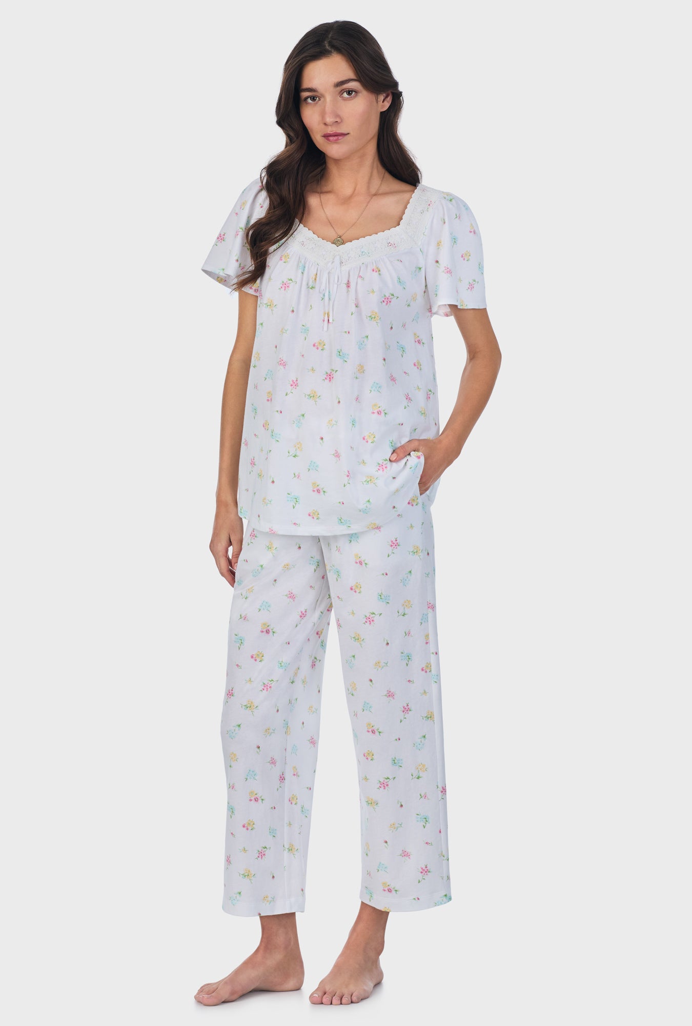 A lady wearing white short Sleeve Cotton Capri Pajama Set with Cottage Bouquet print.