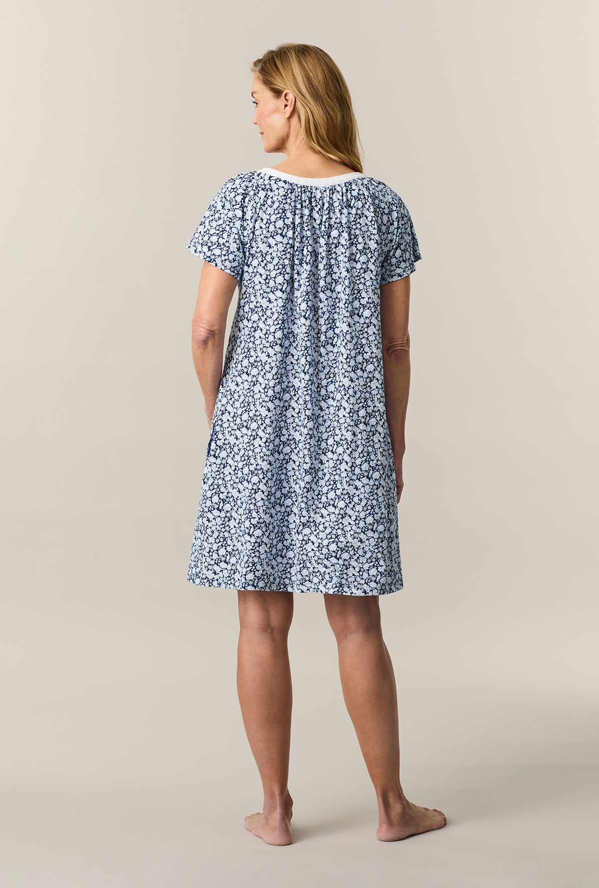 A lady wearing Blue Depths Floral Short Sleeve Cotton Short Nightgown