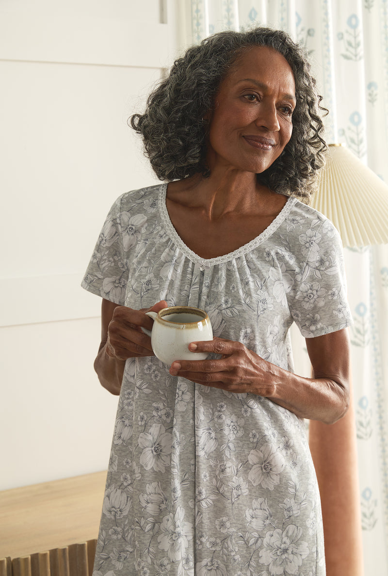 A lady wearing Grey Heather Floral Short Sleeve Cotton Short Nightgown holding a tea cup
