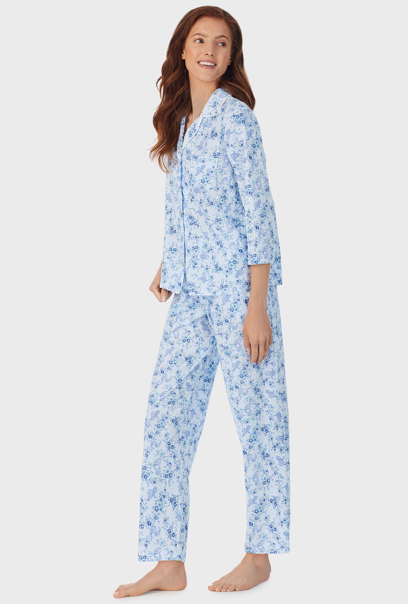 A lady wearing white long pajama set with Paisley Bouquet print