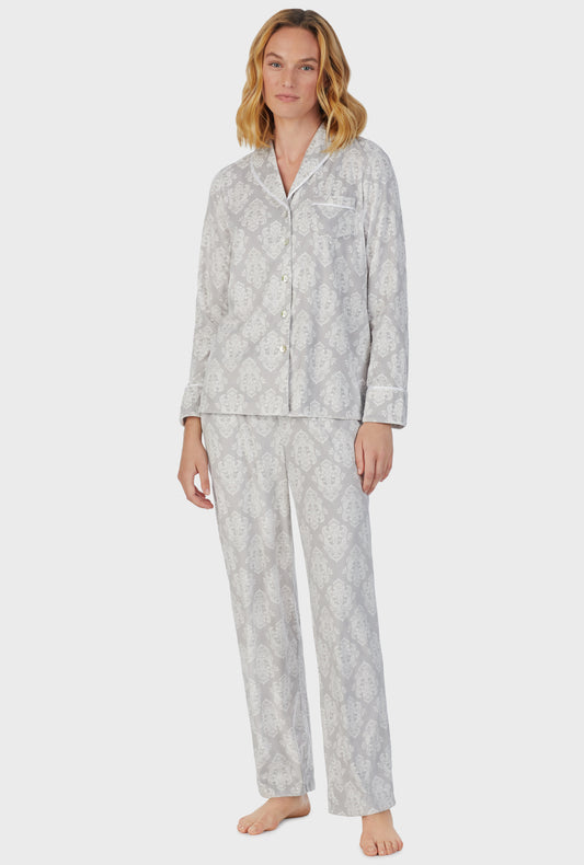 A lady wearing grey long sleeve fleece icy damask pajama set.
